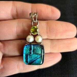 Sterling silver pendant with dichroic glass Peridot stone and 2 faux(?) pearls.